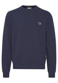 Marineblaue Sweatshirt aus Baumwolle mit Rundhalsausschnitt und gerippten Bündchen. Kleines Logopatch auf der Brust. Klassisches Pullover-Design.