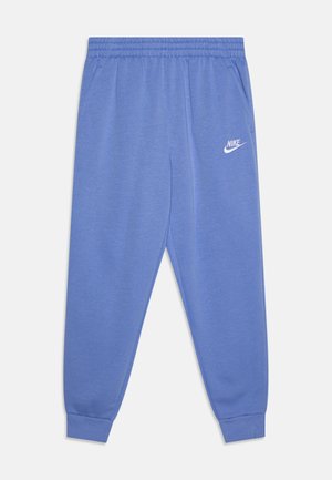 Pantalones de chándal Nike azul hechos de una tela suave, con cintura elástica, bolsillos laterales y un logo Nike blanco en el muslo izquierdo.
