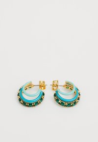 Gold-tone earrings with turquoise accents, featuring a curved design and green gemstones encrusted at the base for added detail.