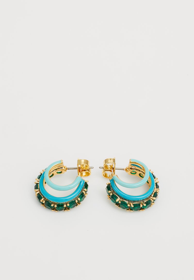 Gold-tone earrings with turquoise accents, featuring a curved design and green gemstones encrusted at the base for added detail.
