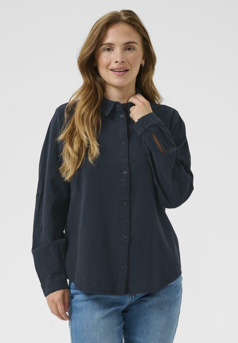 Marine button-up shirt van zachte stof, met een kraag, lange mouwen en een ruime pasvorm met opgerolde manchetten en een gebogen zoom.