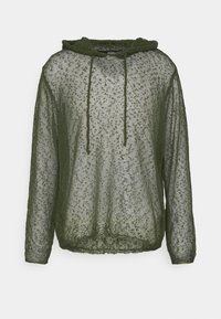 Pullover trasparente verde oliva con cappuccio. Caratterizzato da un cordino, maniche lunghe e un motivo a maglia aperta e testurizzata in tutto il capo.