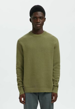 Oliivroheline ribiknitti särk ümarate kaelustega ja pikkade varrukatega, millel on tekstureeritud kangas ning elastsed mansetid ja ääred.