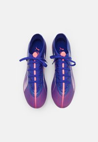 Purple and pink athletic shoes with a textured design, featuring a sleek shape, flat laces, and logo accents on the tongue and sides.