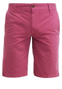 Pink cotton shorts with a smooth texture, two front pockets, and a single button closure at the waist. Mid-thigh length.