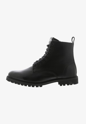 Black leather ankle boot with a round toe, lace-up front, rugged outsole, and a tab loop at the back for easy wear.