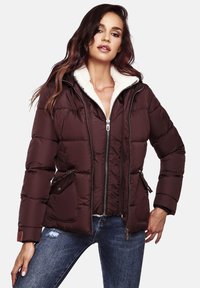 Burgundy puffer jacket with a high collar, zip closure, and faux fur lining. Features two side pockets and a quilted design.
