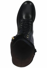 Black leather boot with a smooth finish, round toe, lace-up front, gold-tone hardware, and an inner lining that is darker in color.