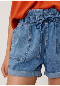 Denim shorts with an elastic waistband and drawstring, featuring two front pockets, cuffed hems, in light blue with subtle fading.