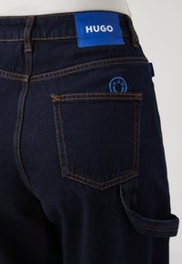 HUGO GETARA B - Wide leg - navy