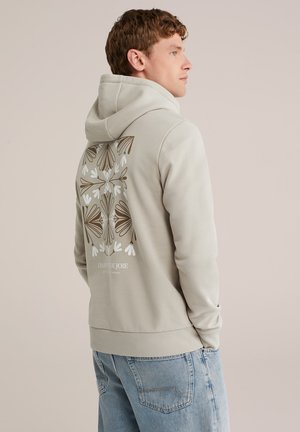 Hellgrauer Hoodie mit floralen Motiven in Braun und Weiß auf dem Rücken. Verfügt über eine Kängurutasche und gerippte Bündchen. Weicher Stoff.