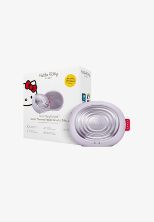 Brosse faciale thermo-sonique ovale Hello Kitty couleur lavande avec un emballage mettant en avant les fonctions 5 en 1 : nettoyage, chauffage et raffermissement.