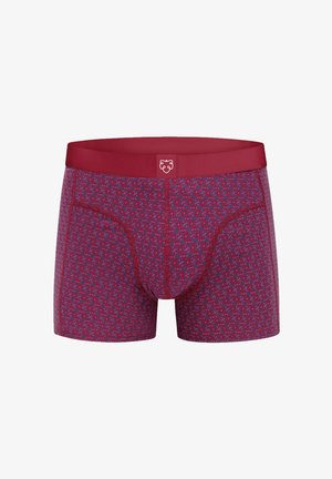 Boxer da uomo rossi con motivo geometrico blu e vita rossa unita con un logo bianco a forma di volto di leone al centro.