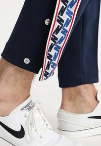 Nike Sportswear Träningsbyxor - dark blue