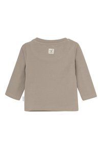 Beige Langarmshirt aus weicher Baumwolle mit rundem Halsausschnitt und einem kleinen Etikett auf der Rückseite mit einem verspielten Tierdesign.