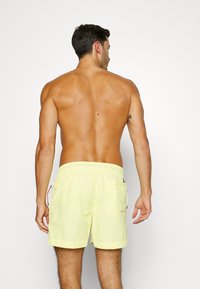 Tommy Hilfiger Fürdőnadrág - mystic yellow