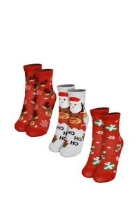Quattro paia di calze festive: rosse con fiocchi di neve e renne, grigie con il volto di Babbo Natale e rosse con regali e bastoncini di zucchero. Miscela di cotone.