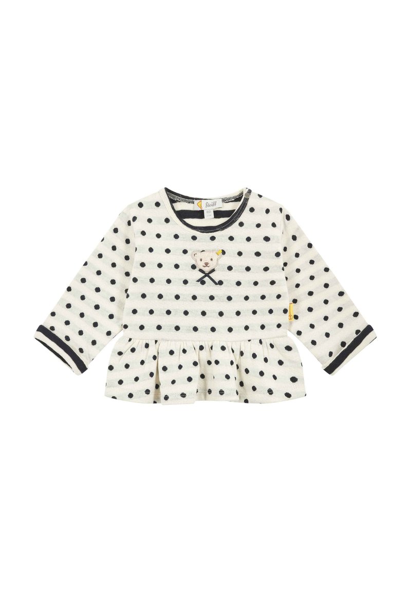 Langärmliges Oberteil in Creme mit schwarzen Punkten, mit einem gerafften Saum und einem bestickten Bärenmotiv auf der Vorderseite, mit kontrastierenden Bündchen.