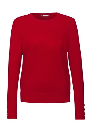 Pull en laine rouge tricoté avec des manches longues, un col rond, des poignets côtelés et des accents de bouton aux bords des manches. Texture lisse et design ajusté.