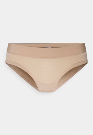 Beige bikinitrosor i texturerat, elastiskt material. Har en bred, slät midjeband och sömlösa kanter för komfort.