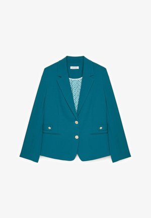 Tyrkis blazer lavet af glat stof med en hakket krave, to forlommer og to guldknaplukninger. Inderlægget har et geometrisk mønster.