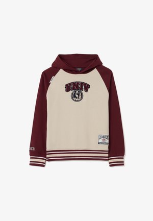 Sudadera con capucha de color beige en el frente y mangas color marrón, con puños y dobladillo a rayas, que presenta parches de "UNIV LSA" y "Los Ángeles California".