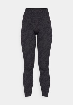 Høytlivet svarte leggings med teksturert leopardmønster, laget av et elastisk materiale, designet for komfort og fleksibilitet.