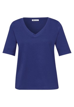 Chemise pour femme à manches courtes, col en V de couleur bleu foncé, coupe décontractée avec une étiquette à l'intérieur du col.