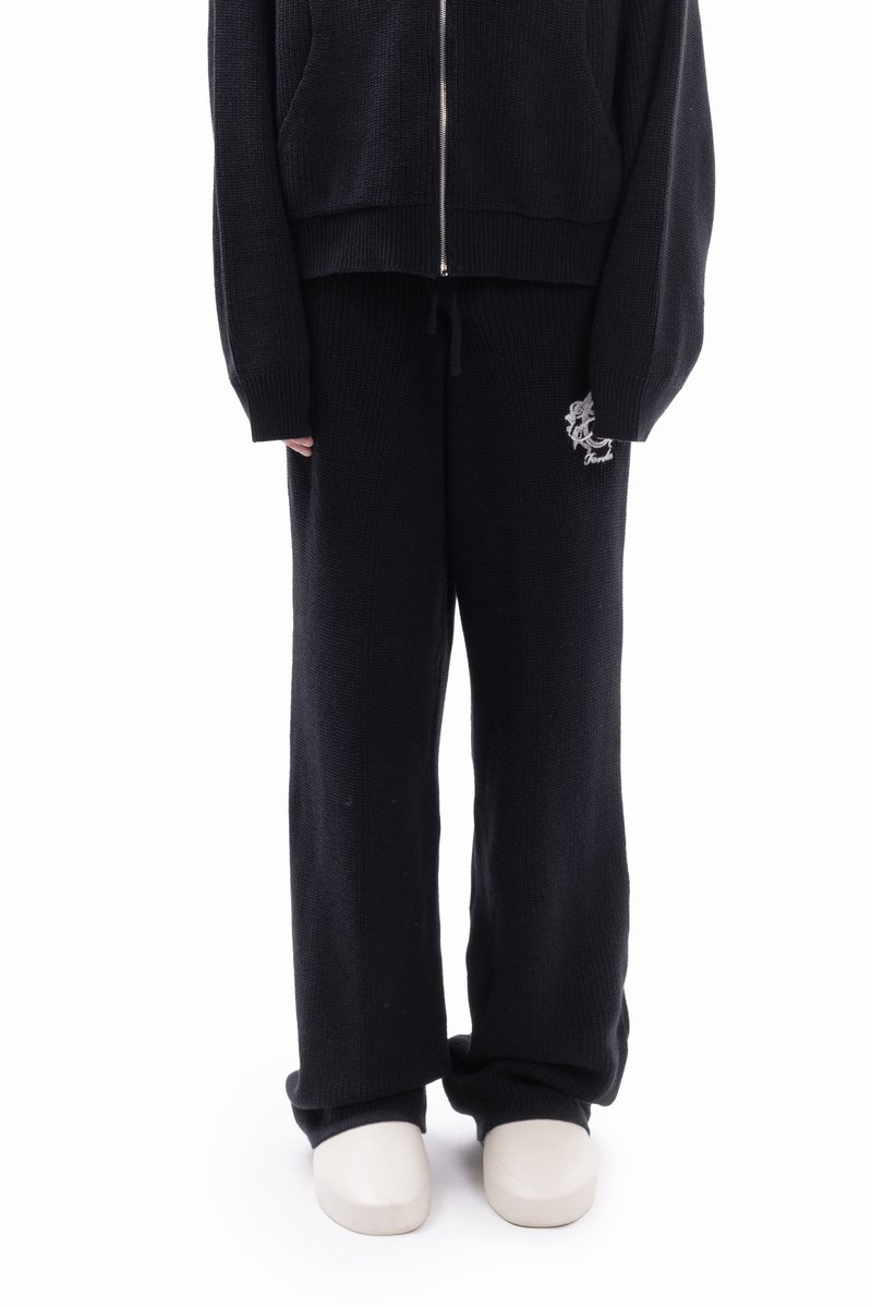 Black knit zip-up hoodie with front pockets and matching drawstring sweatpants. Sweater features ribbed cuffs; pants have an embroidered design.
