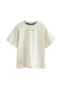 Heledbeez värvi lühikeste varrukatega t-särk, mis on valmistatud pehmest puuvillast. Omab tumedamas toonis logo trükki, ümarat kaelust ja vabamat lõiget.