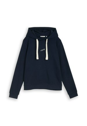 Tumesinist toonitud kapuutsiga pusa valgete nööridega, valgete väikeste südame- ja ristisümbolitega rinnal, pikkade varrukatega ning soonikkoes varrukaäärtega.