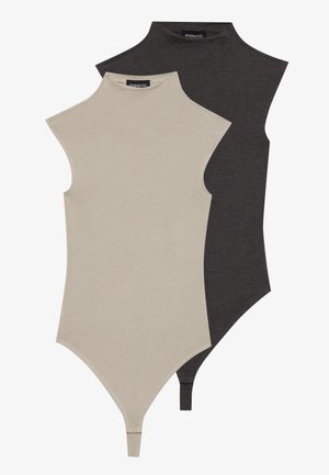 Two sleeveless bodysuits, one beige and one dark grey, featuring a high neck design, smooth texture, and snap closure at the bottom.