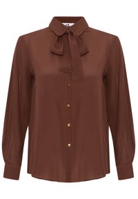Blouse marron à manches longues avec un col rond, un nœud sur le devant et des boutons dorés au centre.