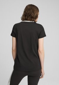 Puma POWER TEE  - Triko s potiskem - black