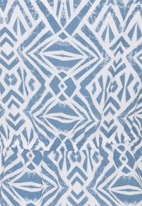 Blue and white fabric featuring a geometric pattern with diamonds and triangles, textured surface, and gathered detail at hem.