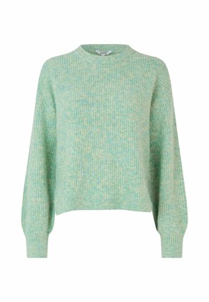 Pull vert clair en tricot texturé, avec un col rond, des manches longues et une silhouette légèrement cropped.