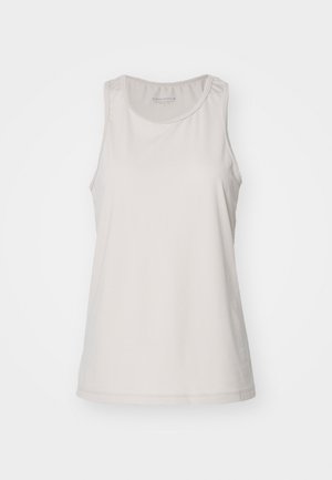 Világos bézs sportfelső, kerek nyakkivágással és ujjatlan kialakítással. Simább, nedvességelvezető anyagból készült. Diszkrét logó részlet található rajta.