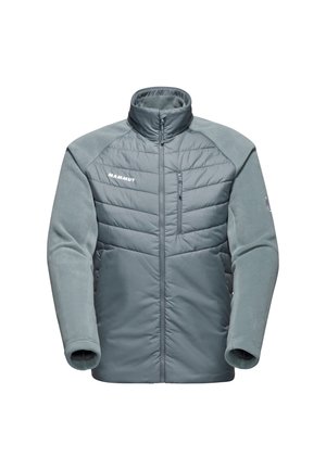 Lichtgewicht, gewatteerde jas in grijs met fleece mouwen, hoge kraag, rits aan de voorkant en borstzak. Heeft het Mammut-logo aan de voorkant.