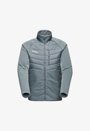 Lekka, ocieplana kurtka w kolorze szarym z polarowymi rękawami, wysokim kołnierzem, zamek błyskawiczny z przodu i kieszenią na piersi. Zawiera logo Mammut z przodu.