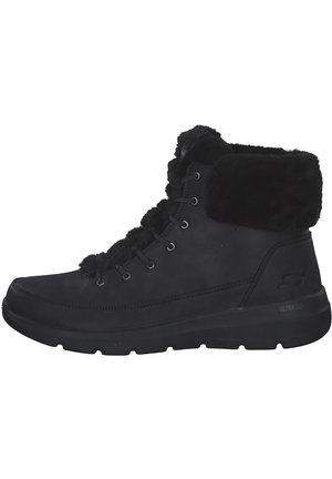 Black ankle boots made of leather with faux fur trim, featuring lace-up design, round toe, and a cushioned sole for comfort.