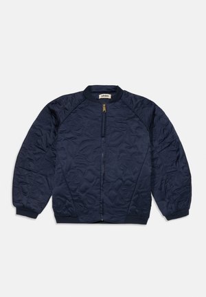 Navy quilted jacket featuring a zip front, ribbed cuffs and hem, and textured floral patterns on the fabric for added detail.