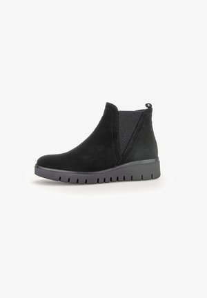 Black suede ankle boot with elastic side panel, pull tab at heel, and thick ridged sole designed for casual wear.
