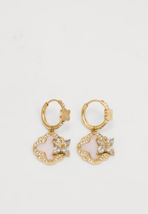 Gold hoop earrings with a scalloped design, featuring a pink stone and clear gemstone accents, adorned with a floral medallion.