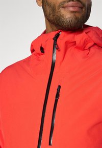 Salomon HIGHLAND JACKET - Suusajakk - cherry tomato/deep black