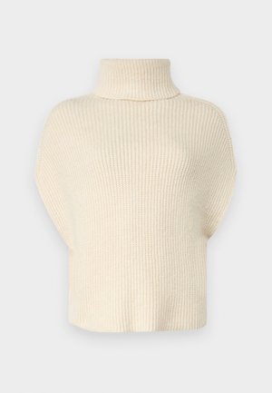 Maglione lavorato a maglia color crema con collo alto a imbuto, maniche corte e una vestibilità ampia. La texture presenta un motivo a coste in tutto il capo.