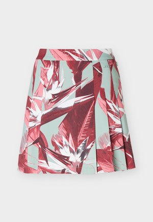 Plissé minirok met turkooise achtergrond en groot rood-wit tropisch bloemenpatroon.