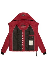 Red puffer jacket with a hood, featuring a contrasting dark lining and white logo. Includes interior tags and a zip pocket on left side.