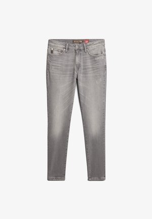 Jeans de mezclilla gris de corte ajustado, con un ligero desgaste, un clásico diseño de cinco bolsillos y un parche rojo de la marca en la parte trasera de la cintura.