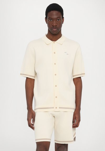 Filling Pieces UNISEX - Lühikesed püksid - antique white