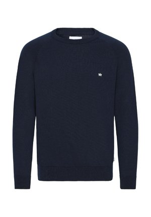 Suéter de punto azul marino, con cuello redondo, mangas largas en raglán, puños y dobladillo de canalé, pequeño logo blanco en el pecho. Corte regular.